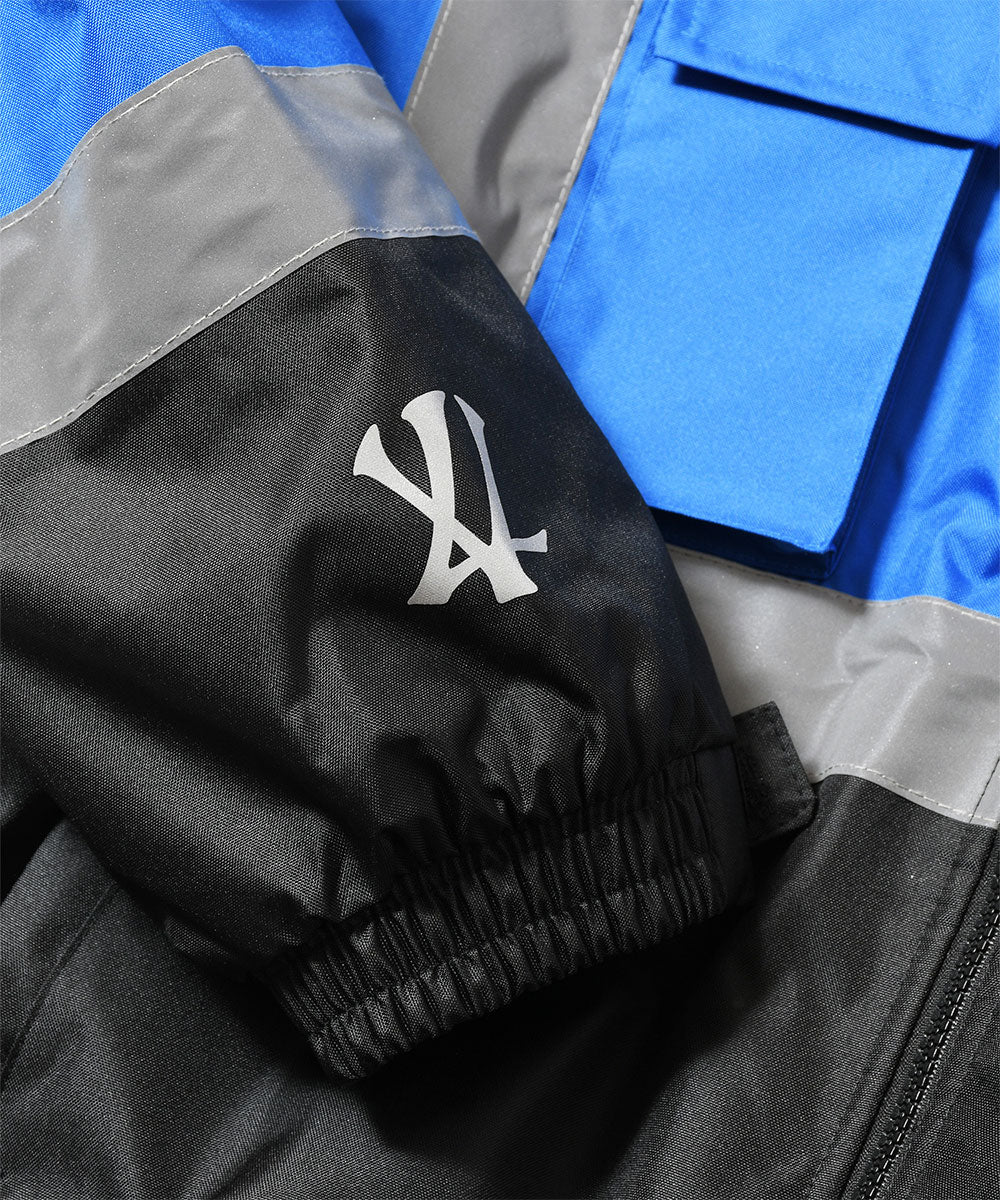 JOMO GLOBAL｜The Dipromats - High-Visibility Jacket Blue