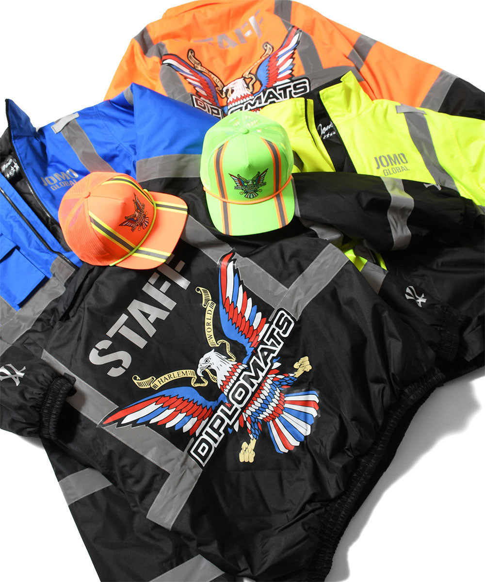 JOMO GLOBAL｜The Dipromats - High-Visibility Jacket Blue