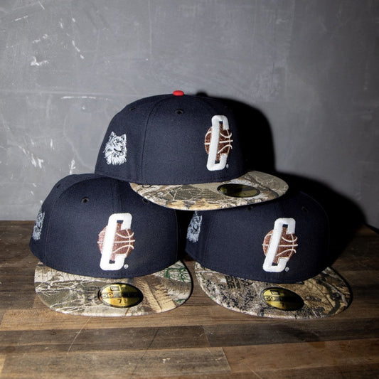 NEW ERA - UConn Huskies Jonathan the Husky 59FIFTY Navy/Real Tree Camo